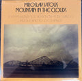 MOUNTAIN IN THE CLOUDS